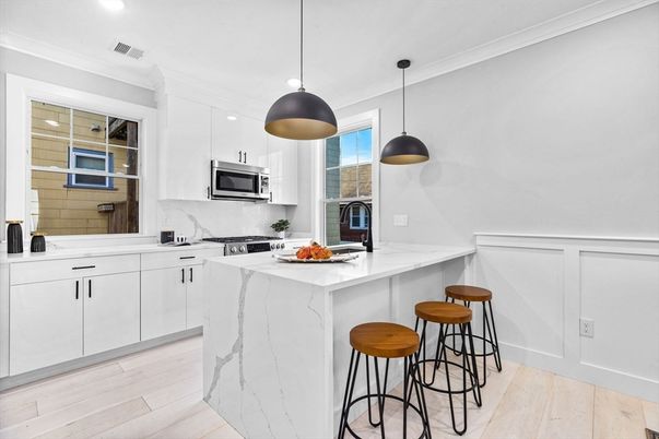 Interior, Kitchen, Marble Walls, Pendant Lights, Recessed Lighting, Stainless Steel Appliances, Wood Texture Flooring