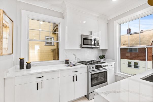 Interior, Kitchen, Marble Walls, Recessed Lighting, Stainless Steel Appliances