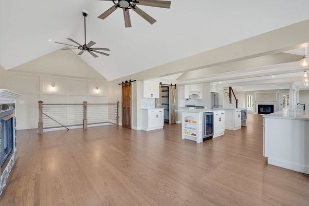 Empty room, Fireplace, Interior, Kitchen, Pendant Lights, Recessed Lighting, Wood Texture Flooring
