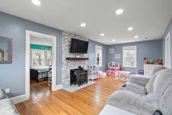 Bedroom, Fireplace, Interior, Recessed Lighting, Stone Walls, Wood Texture Flooring