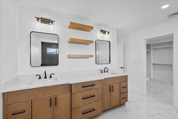 Bathroom, Dual Sink Vanities, Interior, Marble, Recessed Lighting, Walk-in Closets