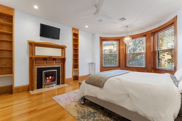 Bedroom, Fireplace, Interior, Pendant Lights, Recessed Lighting, Wood Texture Flooring