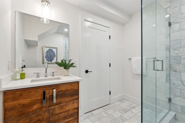Bathroom, Dual Sink Vanities, Glass Shower, Interior, Marble, Marble Walls, Recessed Lighting