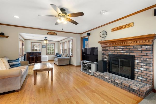 Fireplace, Interior, Living room, Piano, Recessed Lighting, Wood Texture Flooring