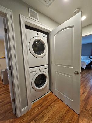 Bedroom, Interior, Recessed Lighting, Utility Closets, Washer, Wood Texture Flooring