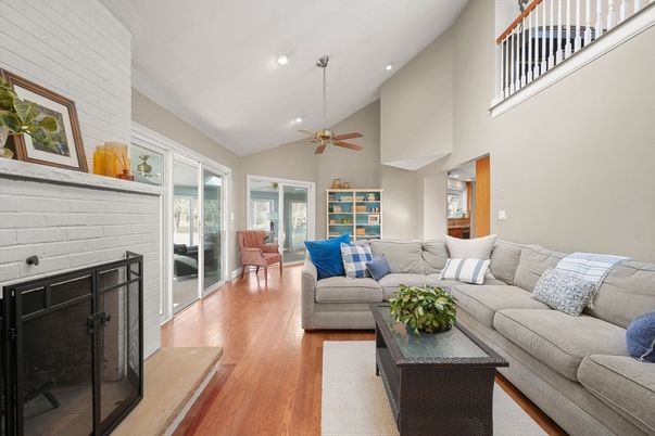 Fireplace, Interior, Living room, Recessed Lighting, Stone Walls, Wood Texture Flooring