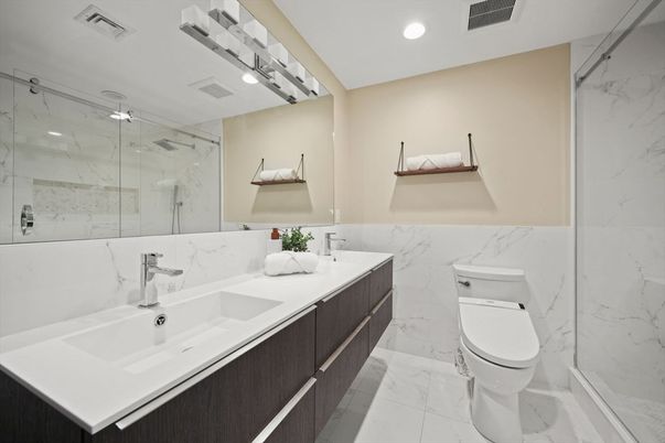Bathroom, Dual Sink Vanities, Glass Shower, Interior, Marble, Marble Walls, Recessed Lighting