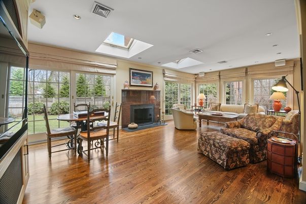 Dining room, Fireplace, Interior, Living room, Recessed Lighting, Wood Texture Flooring
