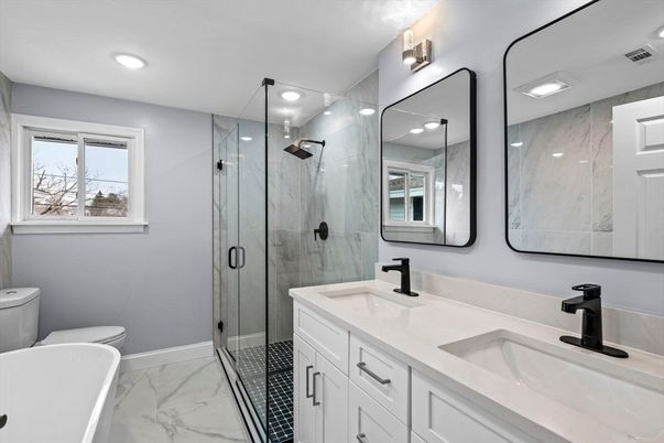 Bathroom, Dual Sink Vanities, Glass Shower, Interior, Marble, Marble Walls, Recessed Lighting