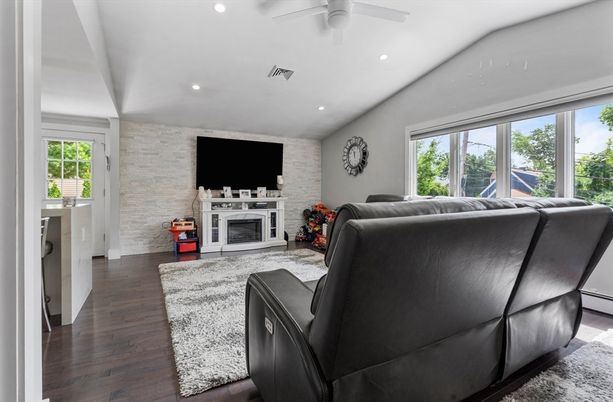 Fireplace, Interior, Living room, Recessed Lighting, Stone Walls, Wood Texture Flooring