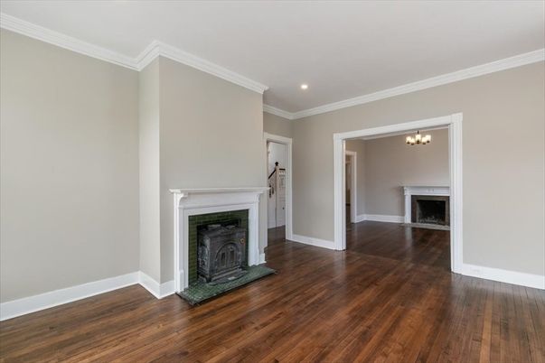 Chandelier, Empty room, Fireplace, Interior, Recessed Lighting, Wood Texture Flooring