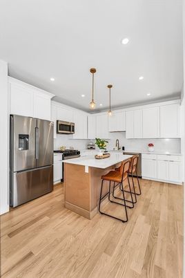 Interior, Kitchen, Pendant Lights, Recessed Lighting, Stainless Steel Appliances, Wood Texture Flooring