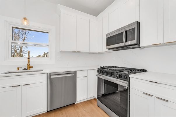 Interior, Kitchen, Marble Walls, Pendant Lights, Stainless Steel Appliances, Wood Texture Flooring