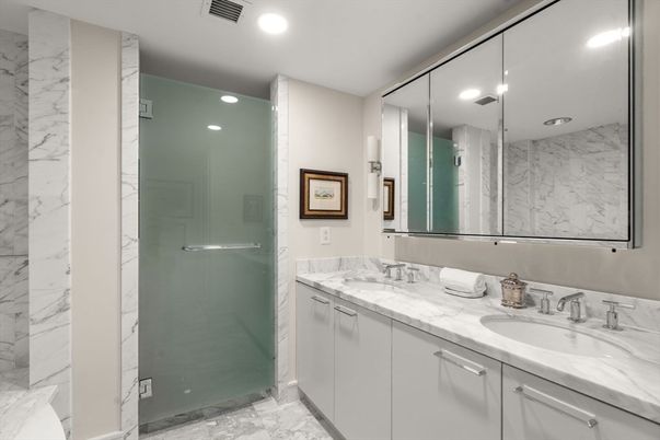 Bathroom, Dual Sink Vanities, Glass Shower, Interior, Marble, Marble Walls, Recessed Lighting