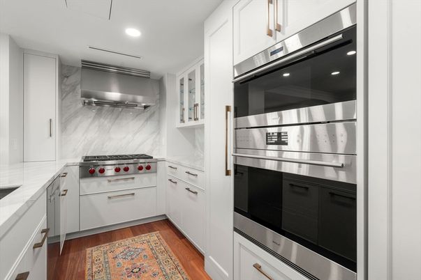 Interior, Kitchen, Marble Walls, Recessed Lighting, Stainless Steel Appliances, Wood Texture Flooring