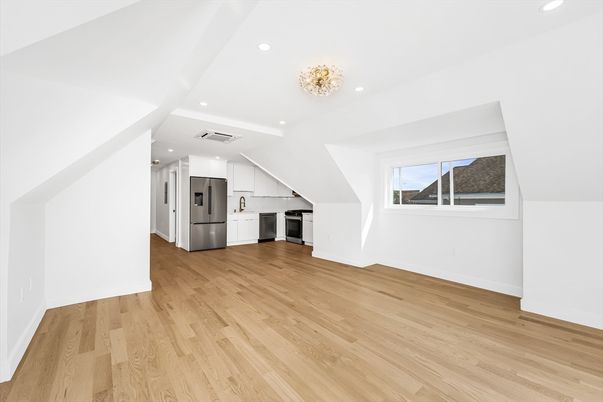 Chandelier, Empty room, Interior, Kitchen, Recessed Lighting, Stainless Steel Appliances, Wood Texture Flooring