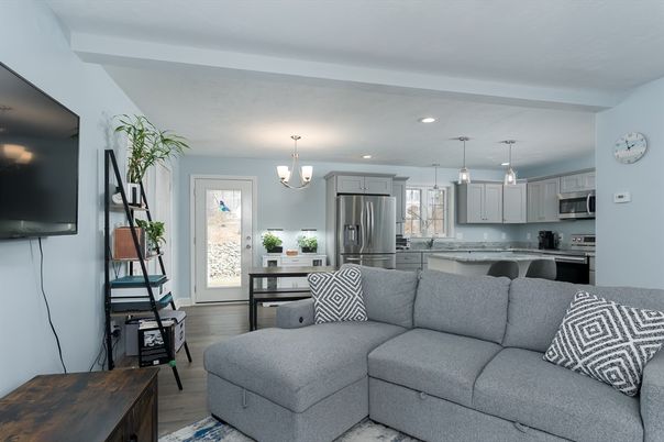 Chandelier, Interior, Kitchen, Living room, Pendant Lights, Recessed Lighting, Stainless Steel Appliances, Wood Texture Flooring