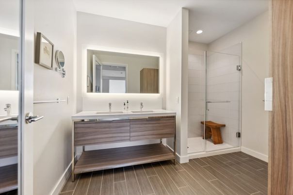 Bathroom, Dual Sink Vanities, Glass Shower, Interior, Recessed Lighting, Wood Texture Flooring
