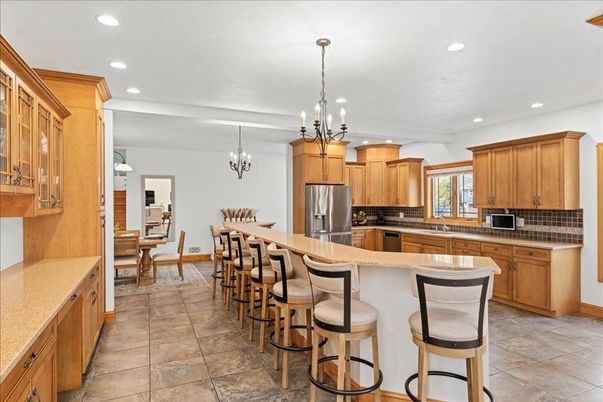 Chandelier, Dining room, Interior, Kitchen, Pendant Lights, Recessed Lighting, Stainless Steel Appliances