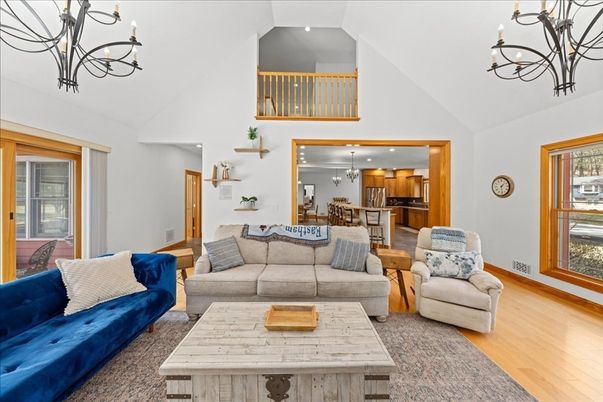 Chandelier, Dining room, Interior, Kitchen, Living room, Pendant Lights, Recessed Lighting, Stainless Steel Appliances, Wood Texture Flooring