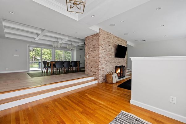 Dining room, Fireplace, Interior, Recessed Lighting, Stone Walls, Wood Texture Flooring