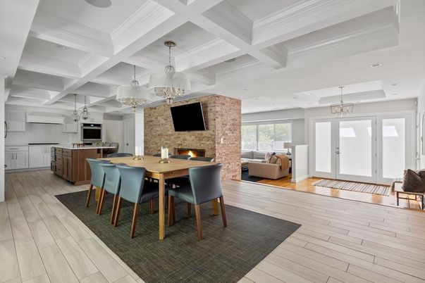 Chandelier, Dining room, Fireplace, Interior, Kitchen, Living room, Pendant Lights, Recessed Lighting, Stone Walls, Wood Texture Flooring