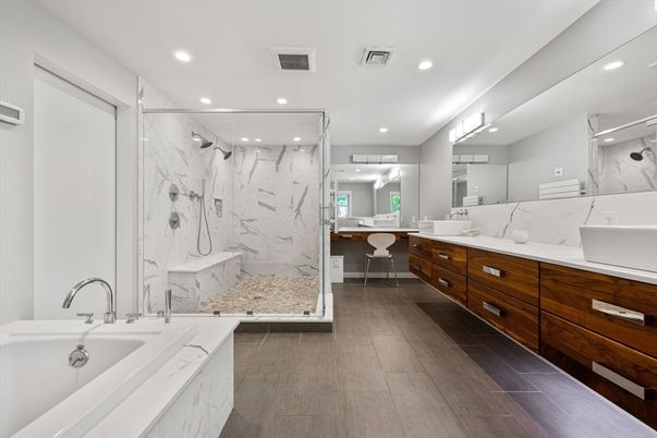 Bathroom, Dual Sink Vanities, Glass Shower, Interior, Marble Walls, Recessed Lighting, Wood Texture Flooring