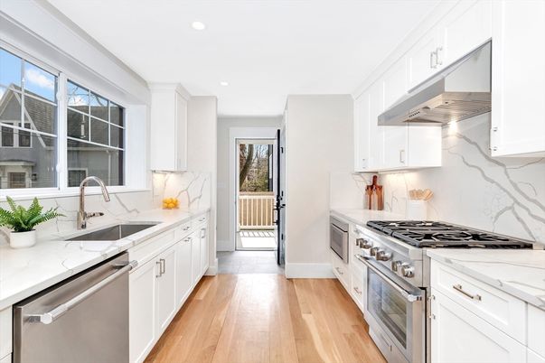 Interior, Kitchen, Marble Walls, Recessed Lighting, Stainless Steel Appliances, Wood Texture Flooring