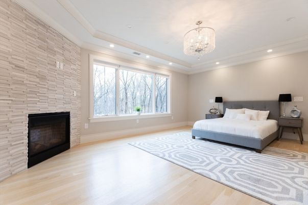 Bedroom, Chandelier, Fireplace, Interior, Recessed Lighting, Stone Walls, Wood Texture Flooring