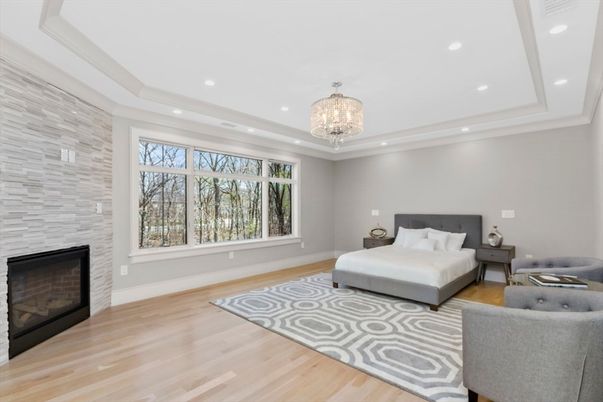 Bedroom, Chandelier, Fireplace, Interior, Recessed Lighting, Stone Walls, Wood Texture Flooring