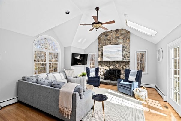 Fireplace, Interior, Living room, Recessed Lighting, Stone Walls, Wood Texture Flooring
