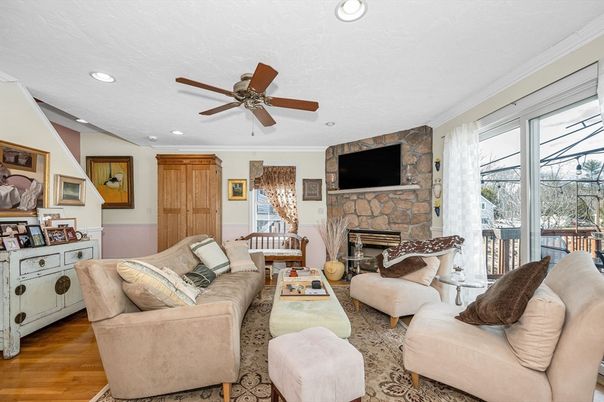 Fireplace, Interior, Living room, Recessed Lighting, Stone Walls, Wood Texture Flooring