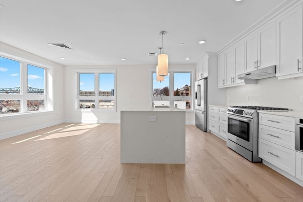 Interior, Kitchen, Pendant Lights, Recessed Lighting, Stainless Steel Appliances, Wood Texture Flooring