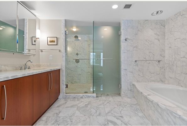 Bathroom, Dual Sink Vanities, Glass Shower, Interior, Marble, Marble Walls, Recessed Lighting