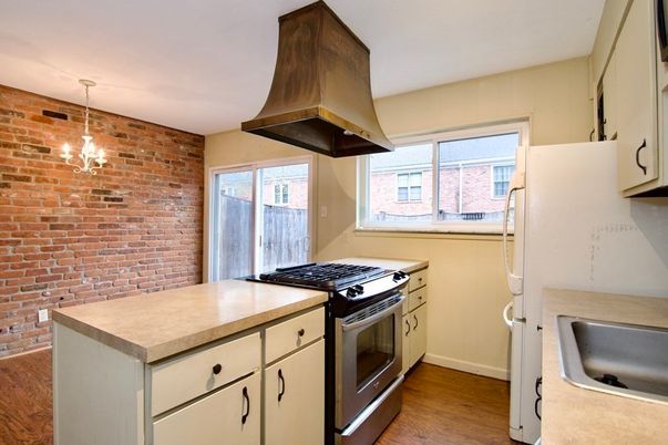 Interior, Kitchen, Pendant Lights, Stainless Steel Appliances, Stone Walls, Wood Texture Flooring