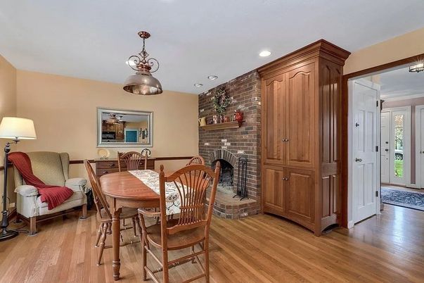 Dining room, Fireplace, Interior, Recessed Lighting, Stone Walls, Wood Texture Flooring