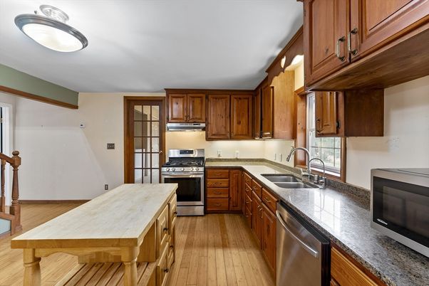 Interior, Kitchen, Stainless Steel Appliances, Tile Countertops, Wood Texture Flooring