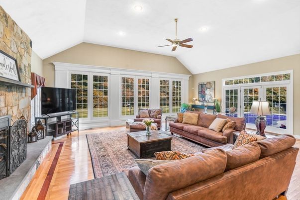 Fireplace, Interior, Living room, Recessed Lighting, Stone Walls, Wood Texture Flooring