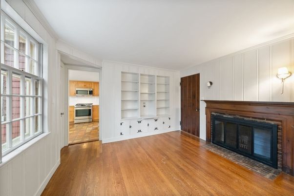 Empty room, Fireplace, Interior, Kitchen, Stainless Steel Appliances, Wood Texture Flooring