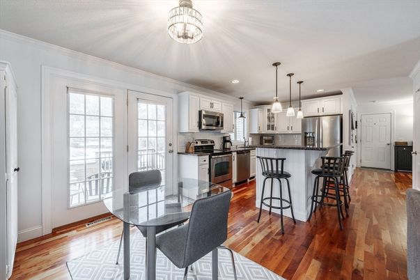 Dining room, Interior, Kitchen, Pendant Lights, Recessed Lighting, Stainless Steel Appliances, Wood Texture Flooring