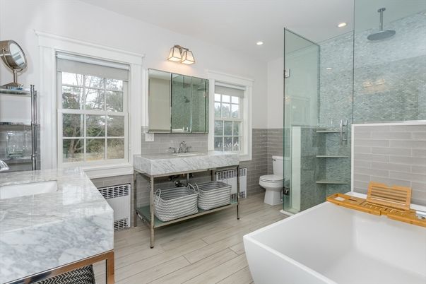 Bathroom, Dual Sink Vanities, Free Standing Baths, Glass Shower, Interior, Recessed Lighting, Wood Texture Flooring