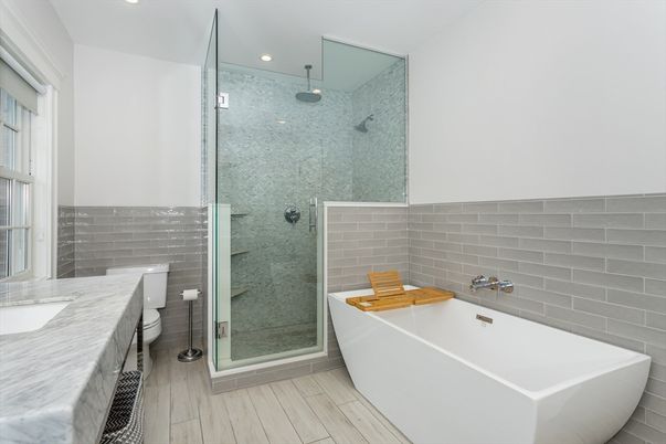 Bathroom, Free Standing Baths, Glass Shower, Interior, Recessed Lighting, Wood Texture Flooring