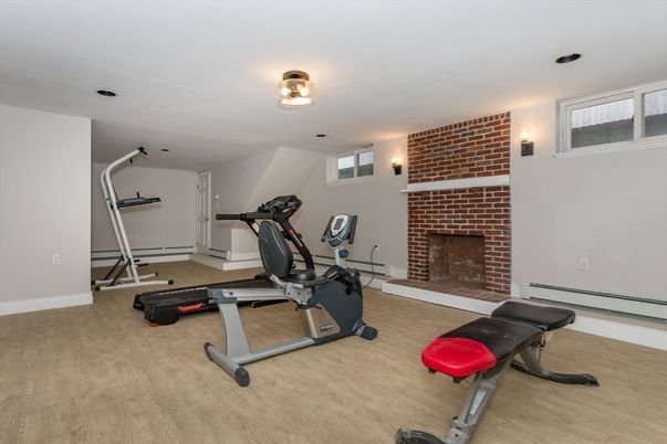 Fireplace, Fitness Equipment, Interior, Stone Walls, Wood Texture Flooring