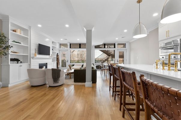 Dining room, Fireplace, Interior, Kitchen, Living room, Pendant Lights, Recessed Lighting, Stainless Steel Appliances, Wood Texture Flooring