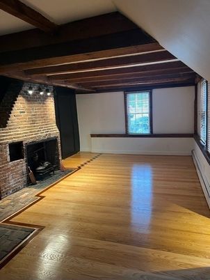 Empty room, Fireplace, Interior, Stone Walls, Wooden Beams, Wood Texture Flooring