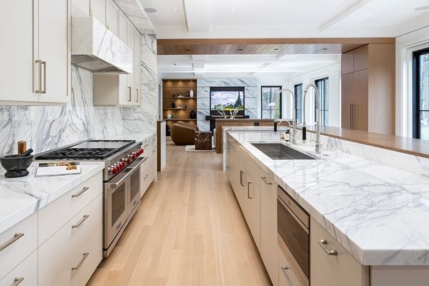 Interior, Kitchen, Marble Walls, Recessed Lighting, Stainless Steel Appliances, Wood Texture Flooring