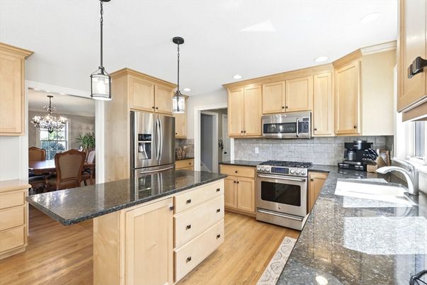Chandelier, Dining room, Interior, Kitchen, Pendant Lights, Recessed Lighting, Stainless Steel Appliances, Wood Texture Flooring