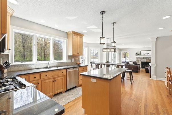 Dining room, Fireplace, Interior, Kitchen, Pendant Lights, Recessed Lighting, Stainless Steel Appliances, Wood Texture Flooring