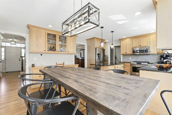 Dining room, Interior, Kitchen, Pendant Lights, Recessed Lighting, Stainless Steel Appliances, Wood Texture Flooring