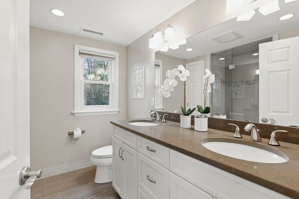 Bathroom, Dual Sink Vanities, Glass Shower, Interior, Recessed Lighting, Wood Texture Flooring